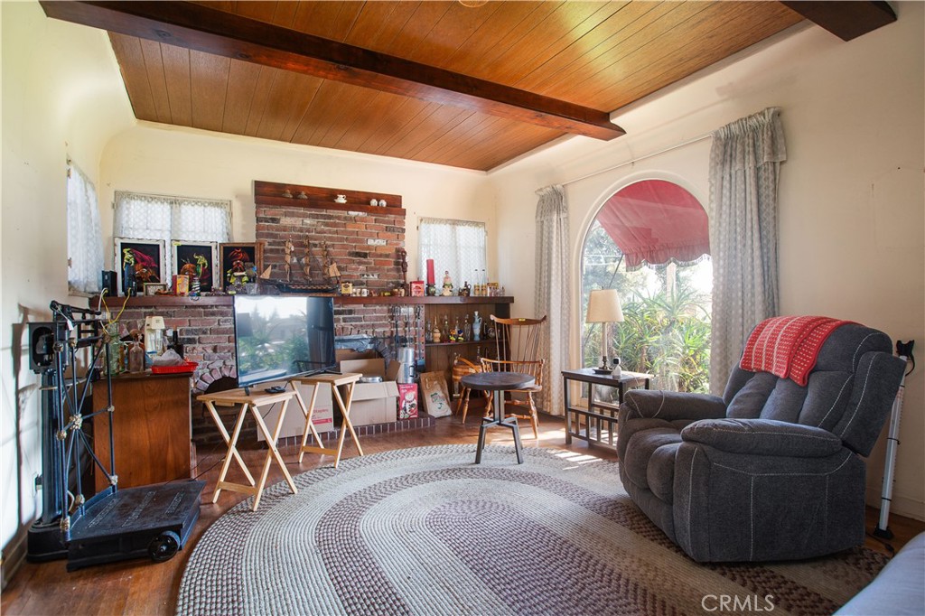 9855 La Rosa Drive Temple City, CA 91780 - Photo 7 of 39 a living room with furniture a flat screen tv and a large window