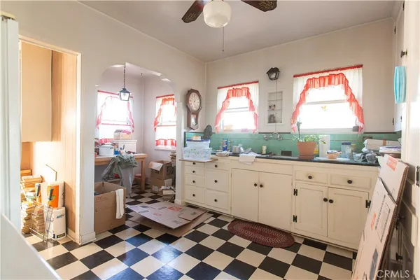 a room with a window and a mirror