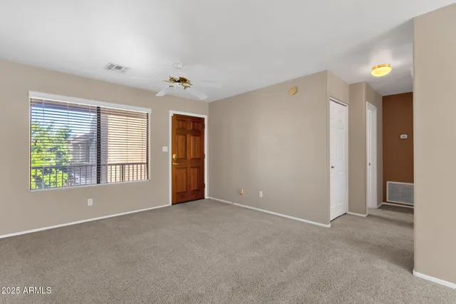 a view of an empty room with a window