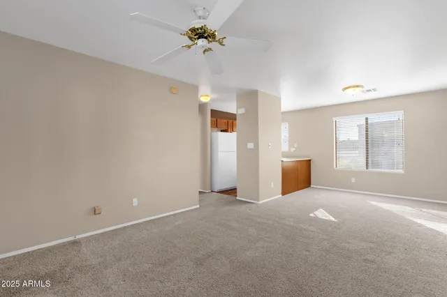 a view of a big room with windows and cabinet