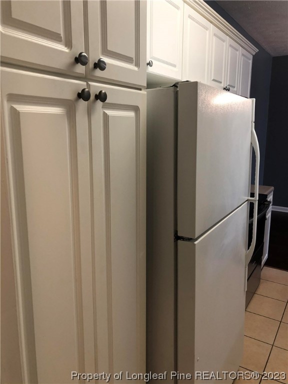 649 Brandermill Road, Unit 203 Fayetteville, NC 28314 - Photo 12 of 26 a close view of a refrigerator in kitchen with stainless steel appliances wooden floor