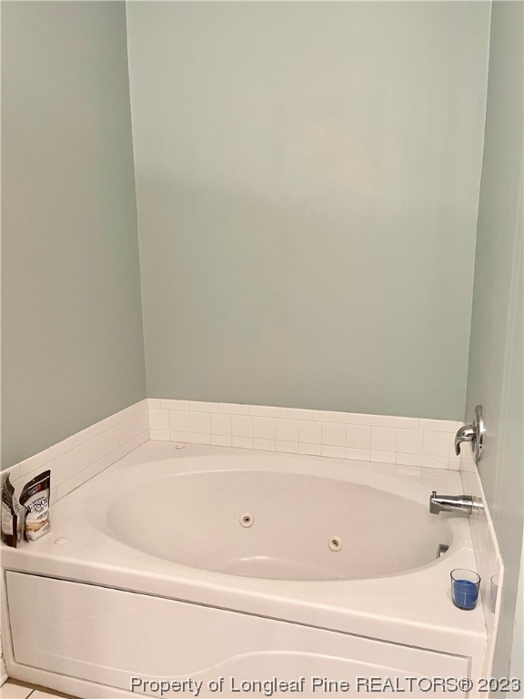 649 Brandermill Road, Unit 203 Fayetteville, NC 28314 - Photo 19 of 26 a bathroom with a bathtub