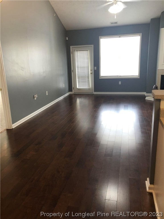 649 Brandermill Road, Unit 203 Fayetteville, NC 28314 - Photo 4 of 26 an empty room with wooden floor and windows