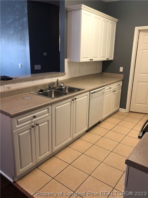 649 Brandermill Road, Unit 203 Fayetteville, NC 28314 - Photo 9 of 26 a kitchen with a sink cabinets and a stove