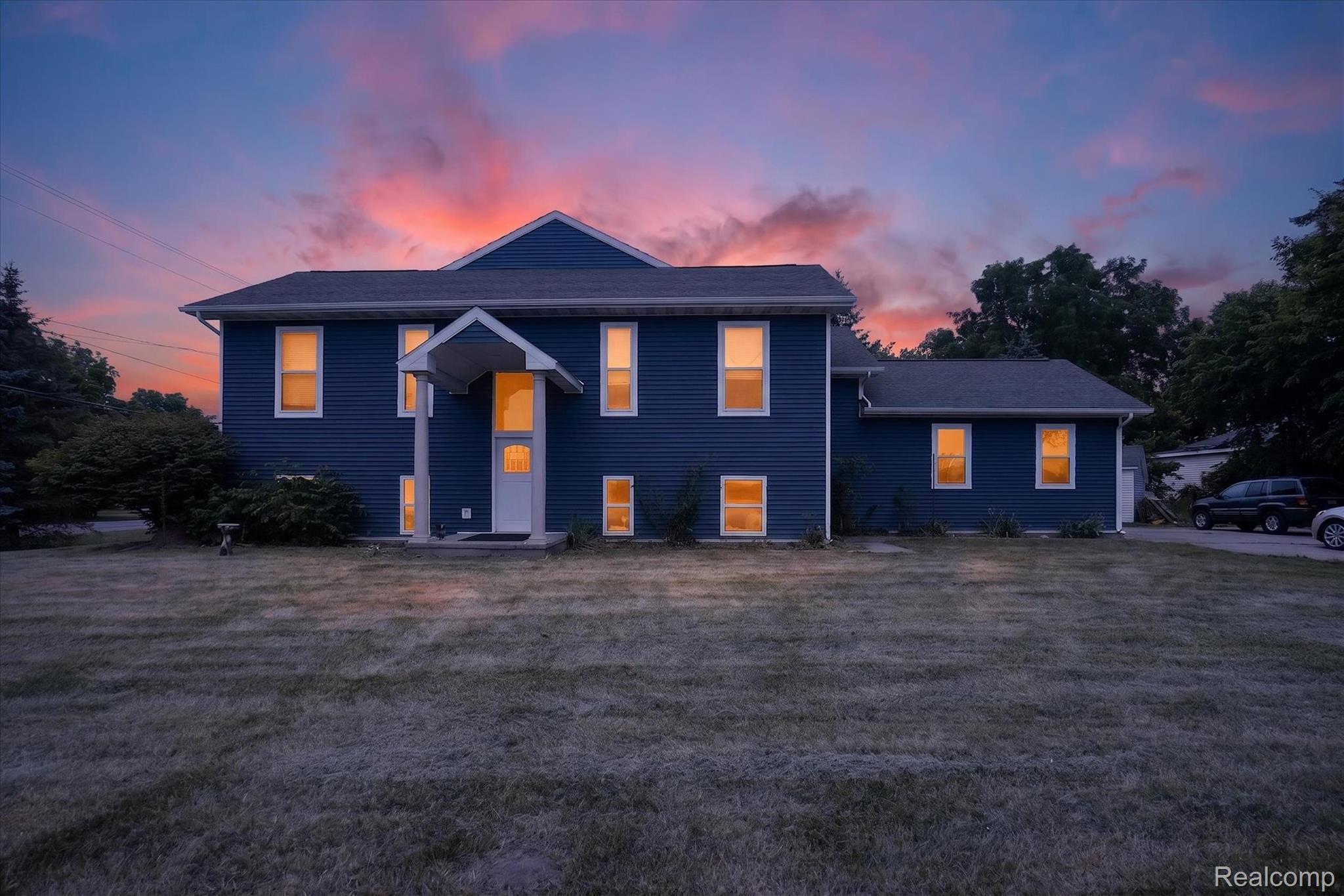 6524 Kelly Road Flushing, MI 48433 - Photo 1 of 47 Two-story residence featuring deep blue siding and a covered front entry
