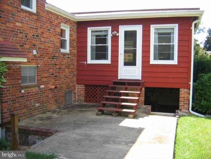 6015 22nd Road North Arlington, VA 22205 - Photo 12 of 16 a front view of a house with a yard