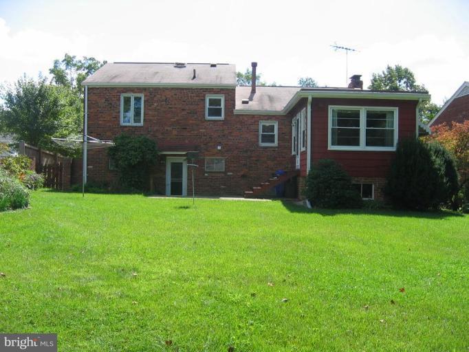 6015 22nd Road North Arlington, VA 22205 - Photo 13 of 16 a front view of house with yard and green space