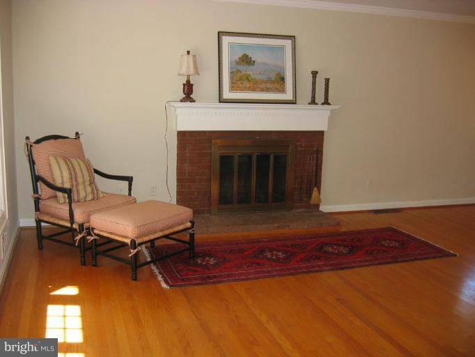 6015 22nd Road North Arlington, VA 22205 - Photo 3 of 16 a living room with furniture and a fireplace