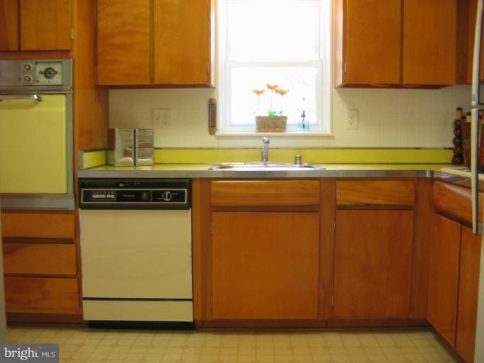 6015 22nd Road North Arlington, VA 22205 - Photo 6 of 16 a kitchen with a sink and a refrigerator