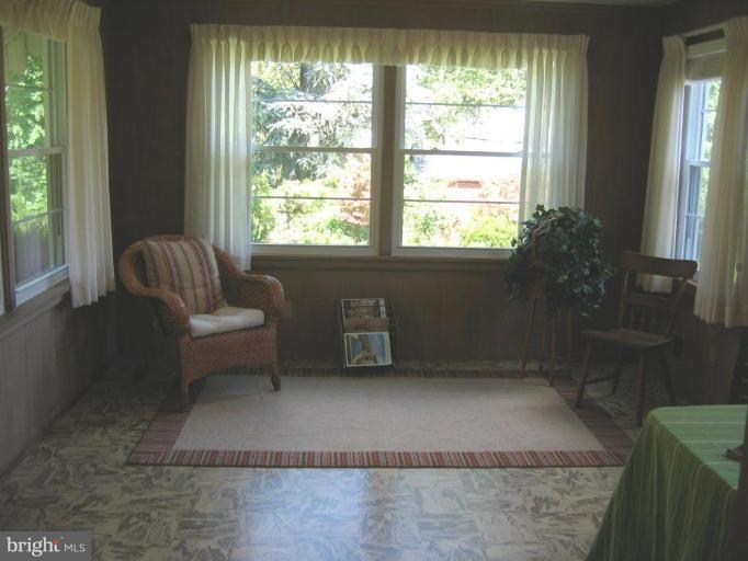 6015 22nd Road North Arlington, VA 22205 - Photo 8 of 16 a living room with furniture and a large window