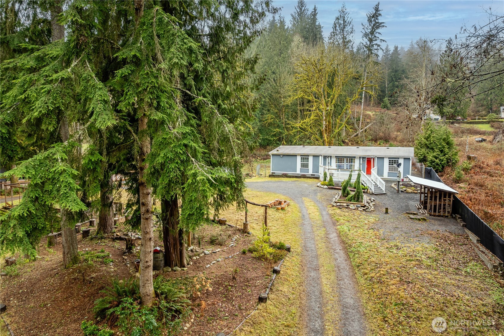 5710 Robe Menzel Road Snohomish, WA 98290 - Photo 3 of 28 a view of a house with backyard and sitting area