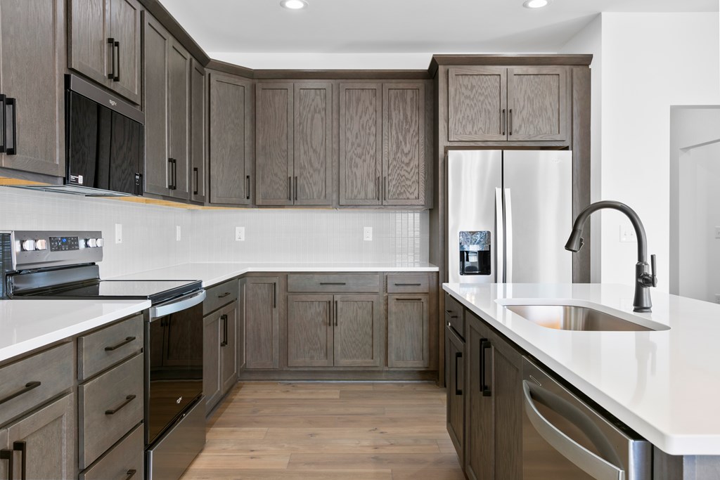 10 West Hawks Nest Road Blairsville, GA 30512 - Photo 16 of 40 a kitchen with stainless steel appliances granite countertop a sink stove and refrigerator