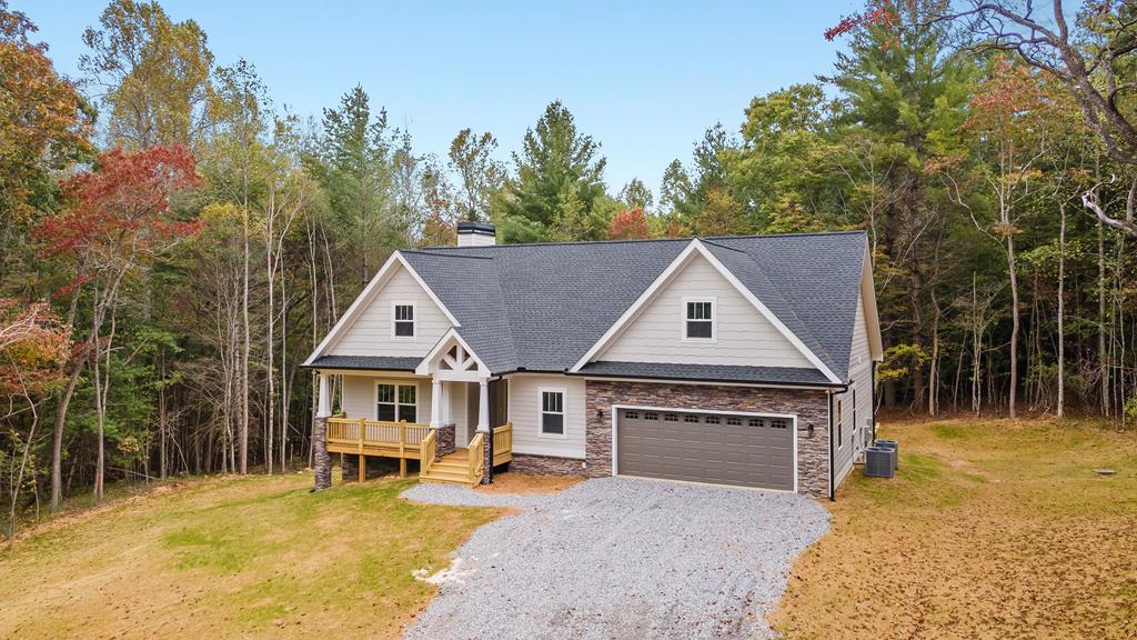 10 West Hawks Nest Road Blairsville, GA 30512 - Photo 24 of 40 a front view of a house with yard and trees in the background