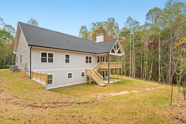 a view of a balcony with wooden floor and cabinet