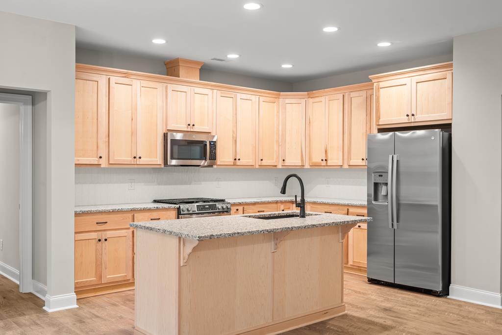 10 West Hawks Nest Road Blairsville, GA 30512 - Photo 37 of 40 a kitchen with stainless steel appliances granite countertop a refrigerator sink and microwave