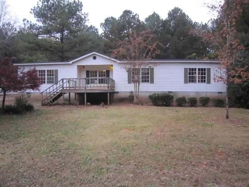 2100 Old Baccus Road Monroe, GA 30656 - Photo 1 of 1 a front view of a house with a yard