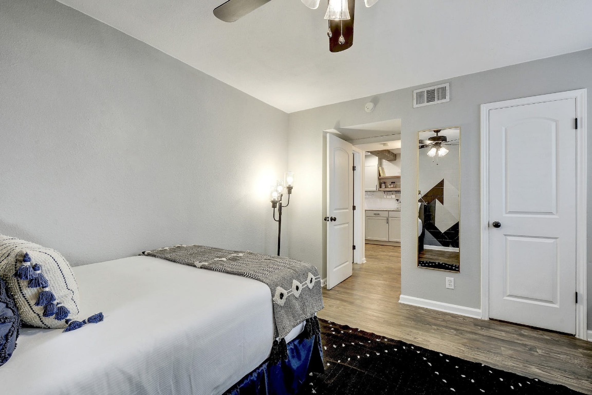 1202 Newning Avenue, Unit 202 Austin, TX 78704 - Photo 18 of 20 Bedroom featuring wood finished floors and a ceiling fan