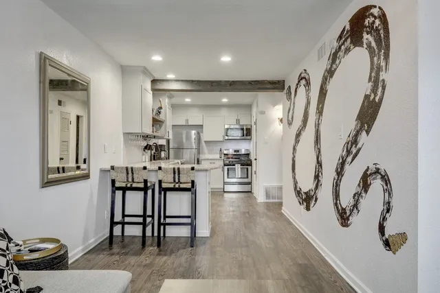 a dining room with furniture and entryway