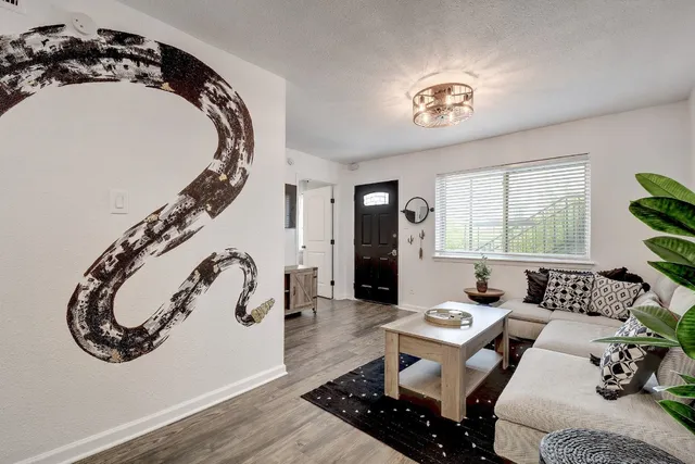 a living room with furniture and a large window