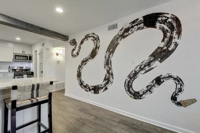 a bathroom with a sink and mirror