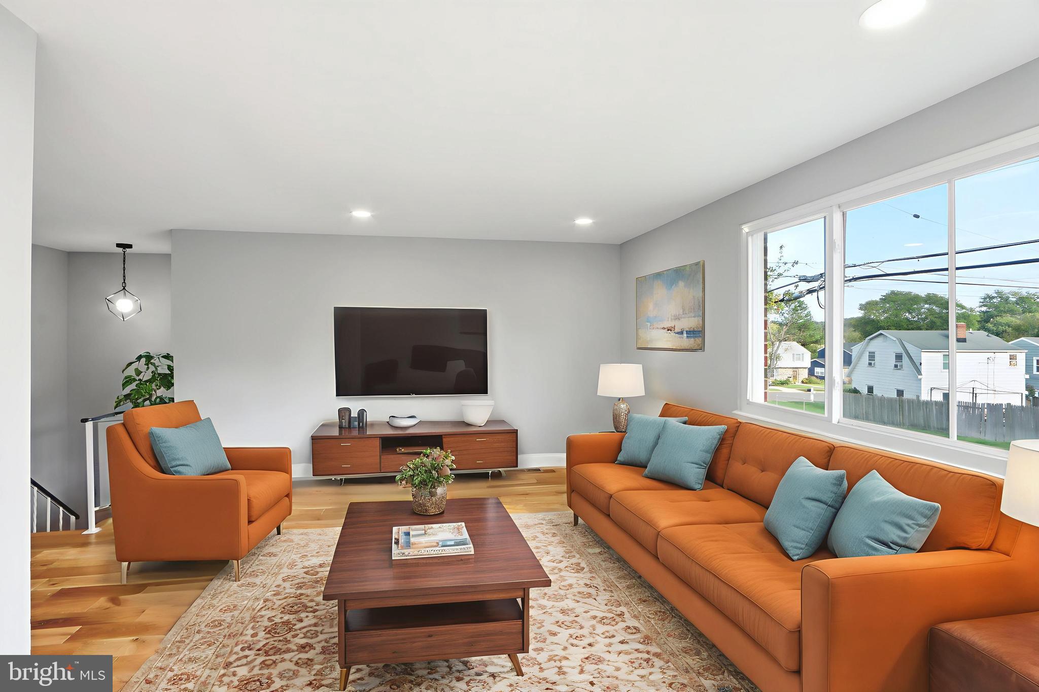 5006 Shelbourne Road Halethorpe, MD 21227 - Photo 13 of 48 a living room with furniture and a flat screen tv
