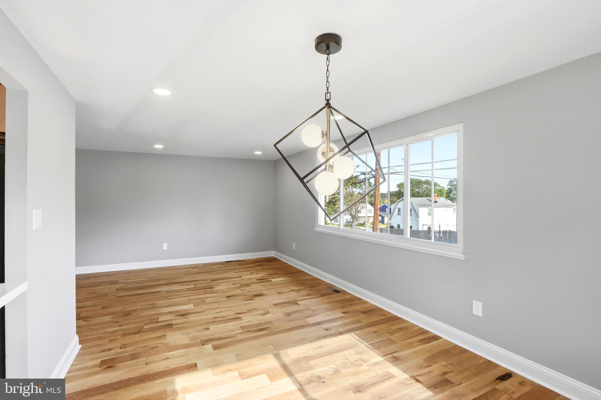 5006 Shelbourne Road Halethorpe, MD 21227 - Photo 15 of 48 a view of a room with window and chandelier