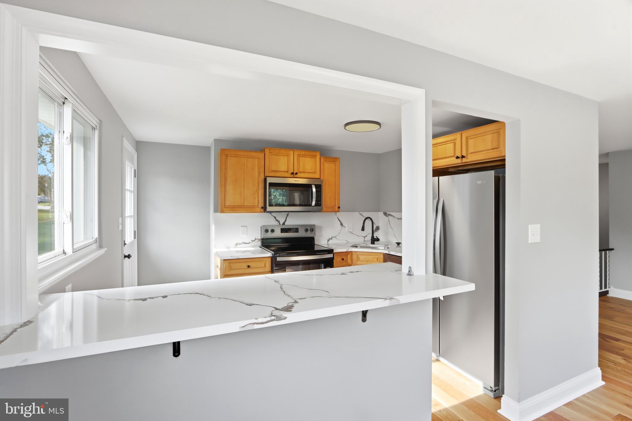 5006 Shelbourne Road Halethorpe, MD 21227 - Photo 16 of 48 a kitchen with a sink appliances and cabinets
