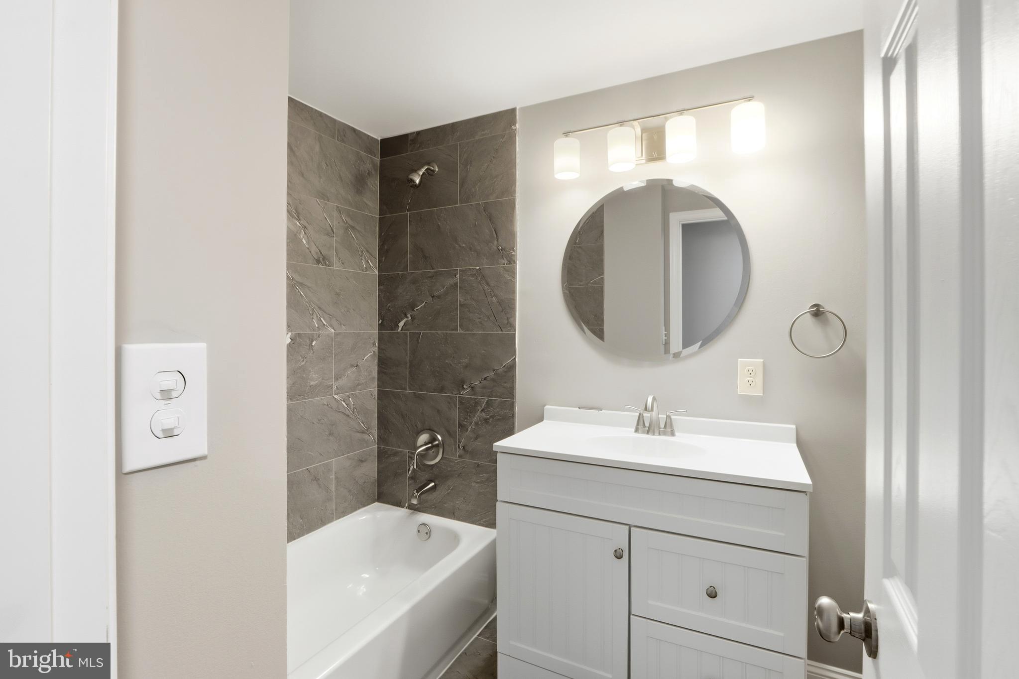 5006 Shelbourne Road Halethorpe, MD 21227 - Photo 21 of 48 a bathroom with a sink and a mirror