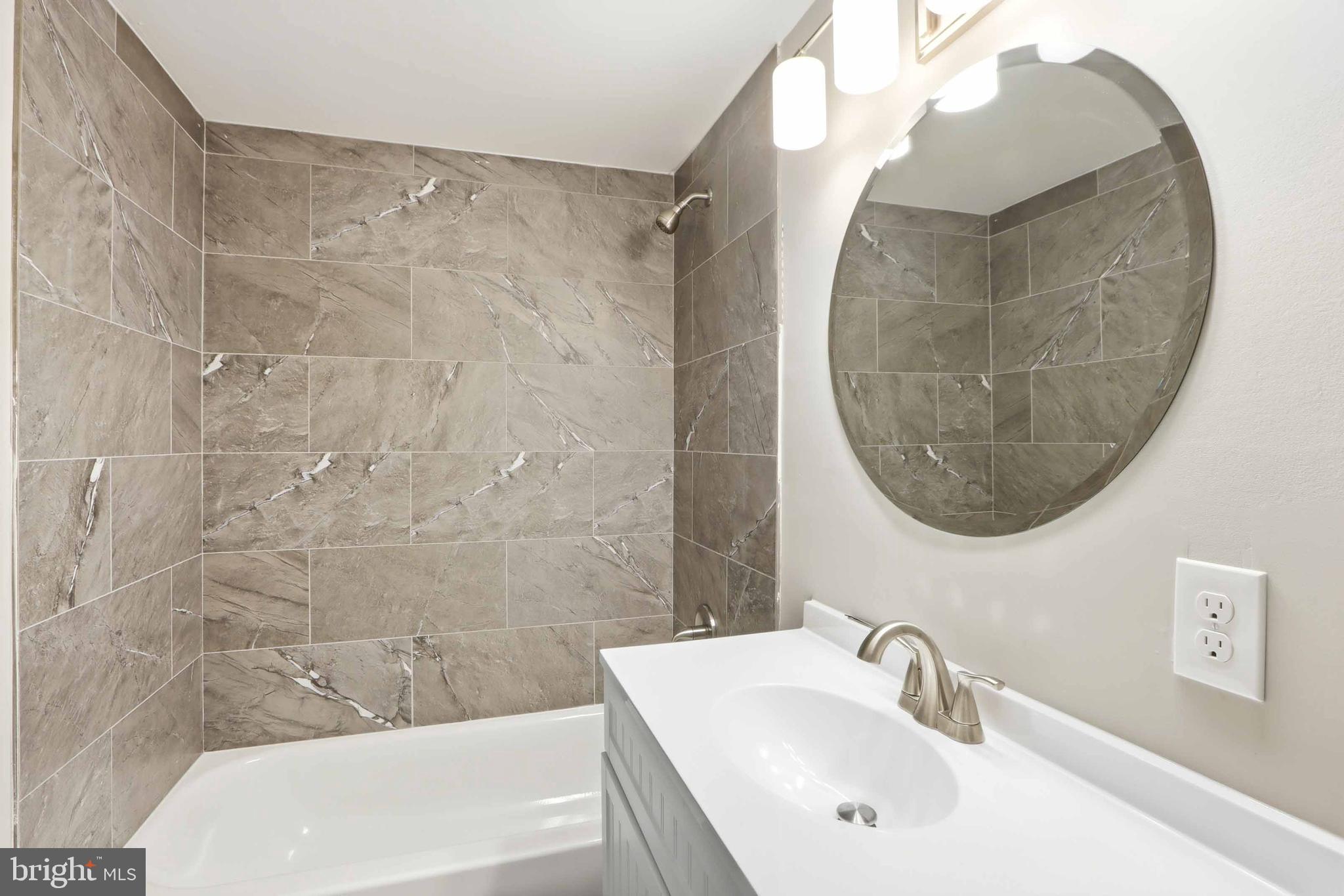 5006 Shelbourne Road Halethorpe, MD 21227 - Photo 22 of 48 a bathroom with a sink and a mirror