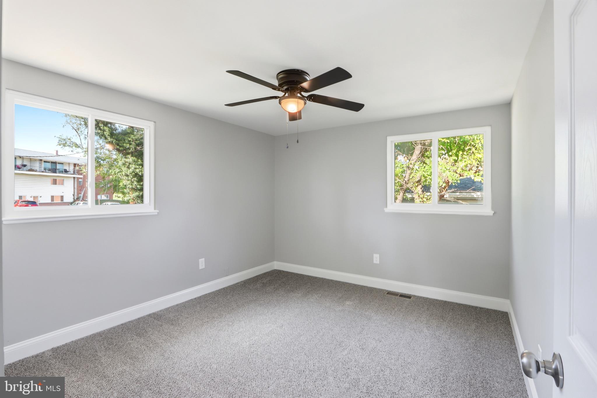 5006 Shelbourne Road Halethorpe, MD 21227 - Photo 27 of 48 a view of room with a ceiling fan and window