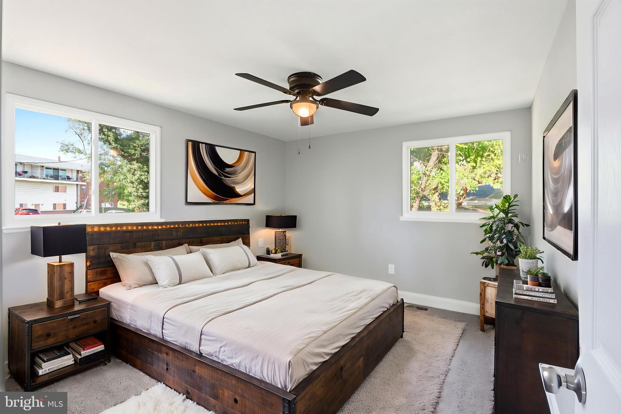 5006 Shelbourne Road Halethorpe, MD 21227 - Photo 28 of 48 a bedroom with bed and a chandelier