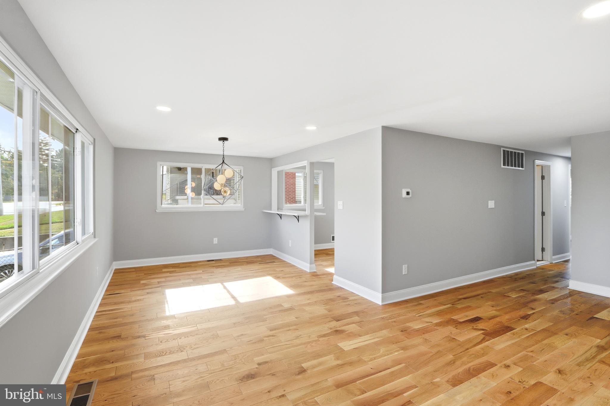 5006 Shelbourne Road Halethorpe, MD 21227 - Photo 6 of 48 a view of empty room with wooden floor and fan
