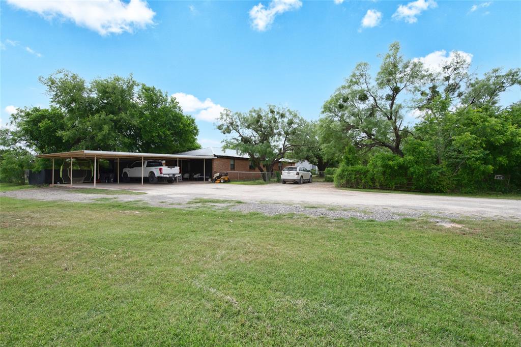 117 Buchanan Road Abilene, TX 79606 - Photo 7 of 40 a view of a house with backyard sitting area and garden