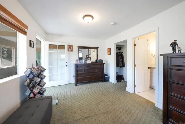 a bed room with furniture and a closet