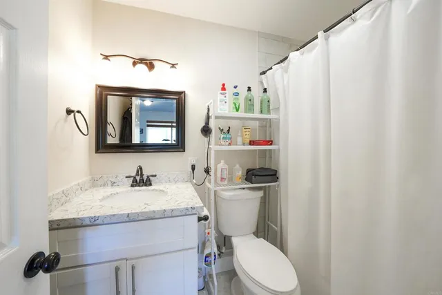 a view of a workspace with furniture and a workspace