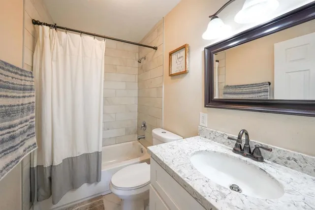 a view of a livingroom with furniture and wooden floor