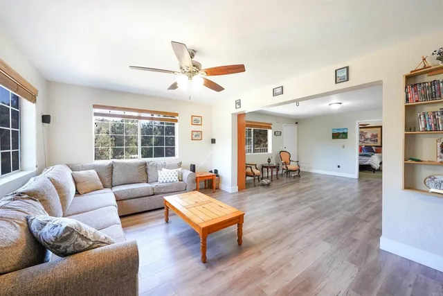 a view of a livingroom with furniture and wooden floor