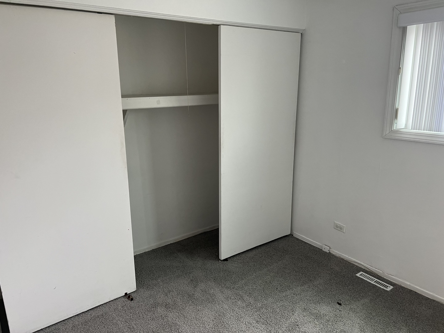 238 Algonquin Court, Unit D Bolingbrook, IL 60440 - Photo 12 of 13 an empty room with windows