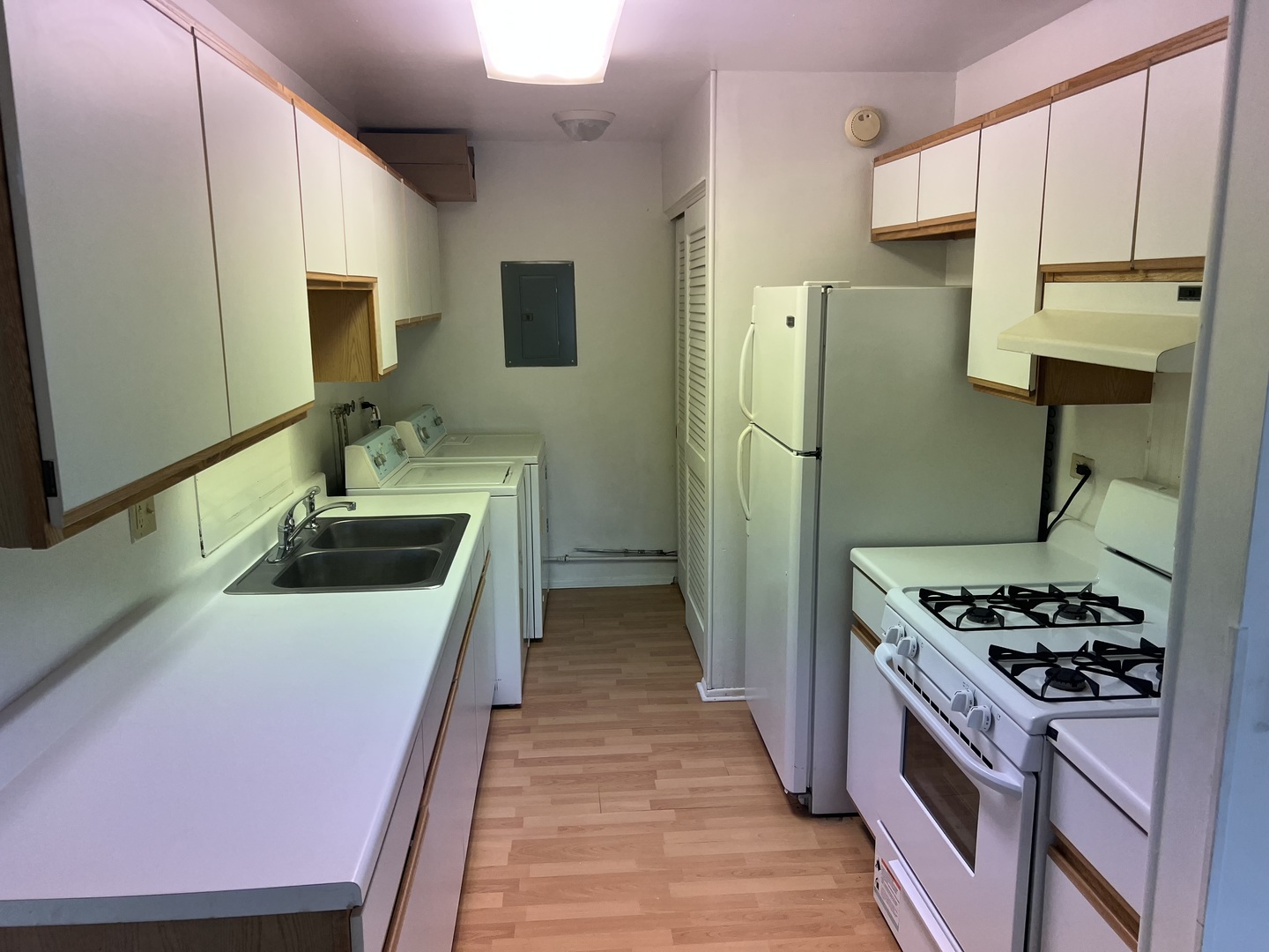 238 Algonquin Court, Unit D Bolingbrook, IL 60440 - Photo 3 of 13 a kitchen with stainless steel appliances a stove a sink and a refrigerator