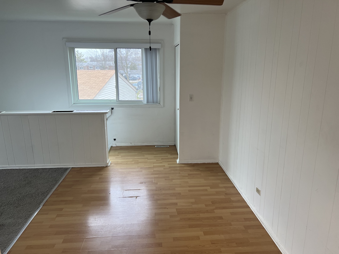 238 Algonquin Court, Unit D Bolingbrook, IL 60440 - Photo 6 of 13 an empty room with wooden floor and windows