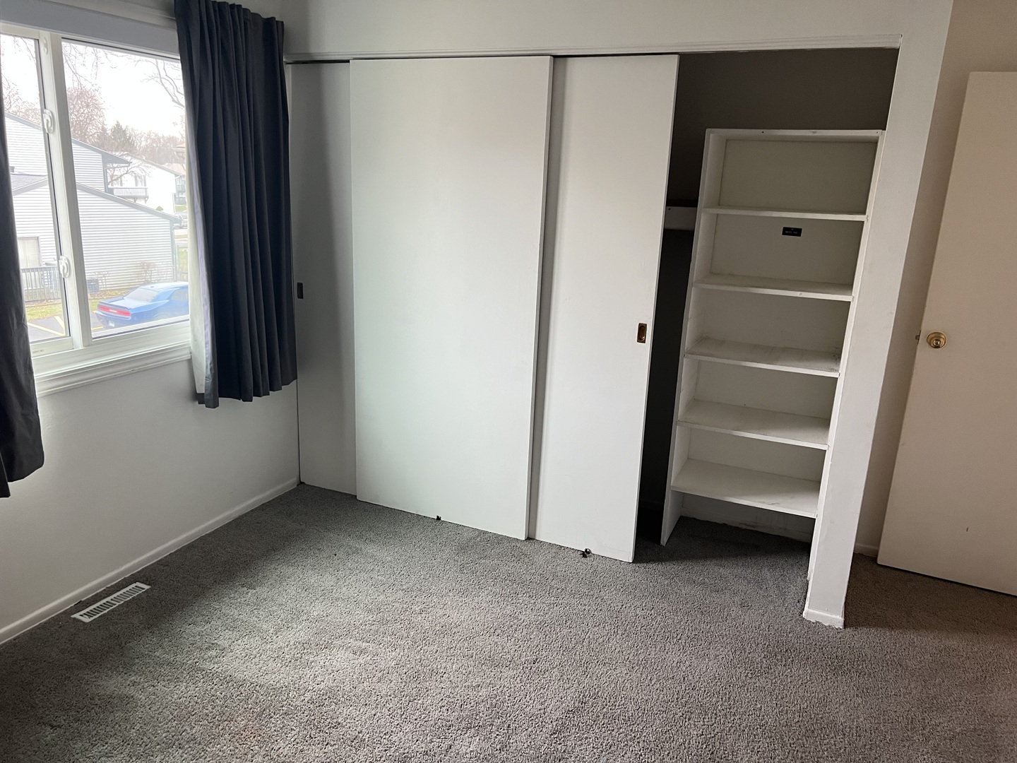 238 Algonquin Court, Unit D Bolingbrook, IL 60440 - Photo 8 of 13 a view of an empty room with a window