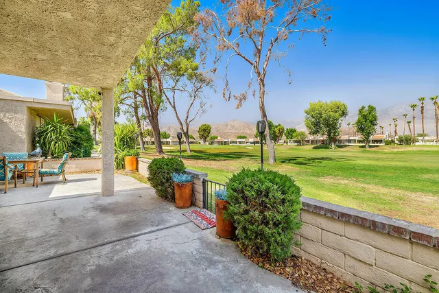 a view of a garden with an outdoor space