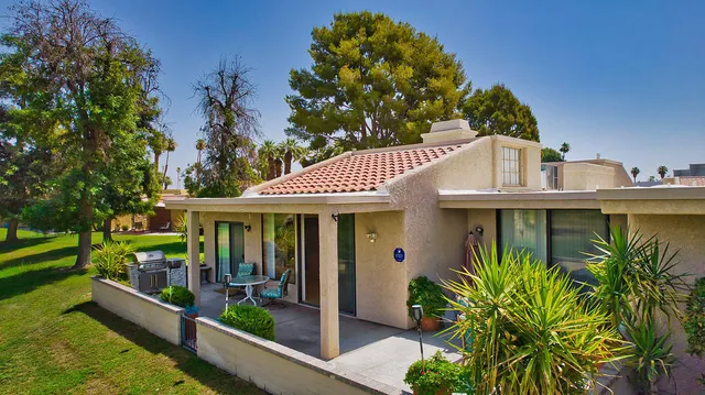 a view of a swimming pool with a sitting area