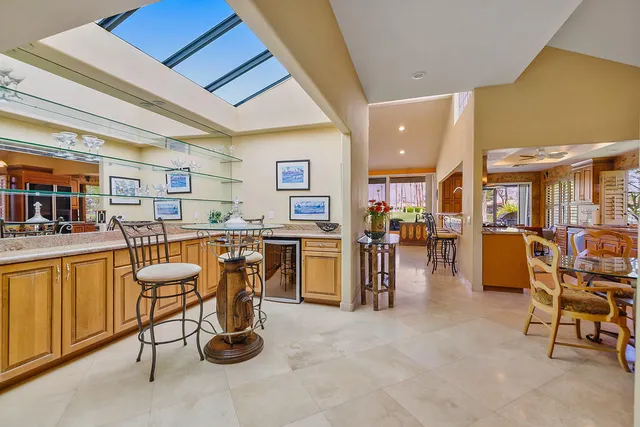 a view of a living room and kitchen with furniture and a kitchen