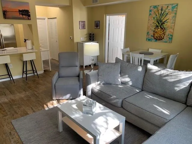 a living room with furniture and a table