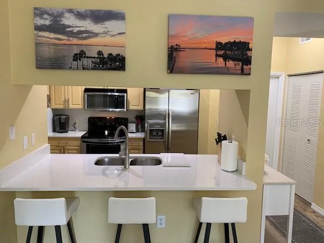 a kitchen with a table and chairs