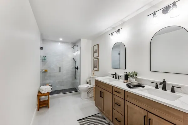 a bathroom with a toilet and a shower