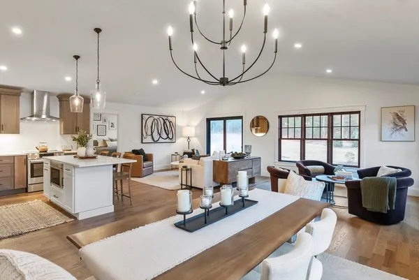 a living room with kitchen island furniture and a large window