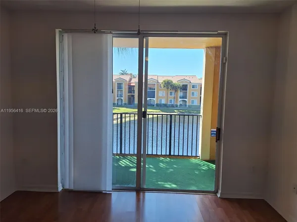 a view of a porch with a floor to ceiling window