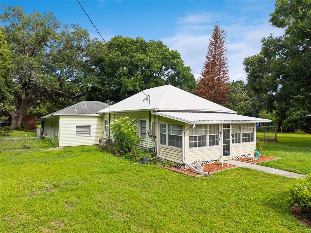 420 Jacks Memorial Road St. Cloud, FL 34769 - Photo 2 of 31 a view of a house with a backyard